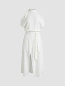 White mock neck dress with short sleeves, tie waist, and front slit, front view.