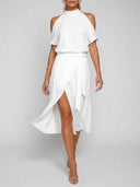 White halter neck dress with cold shoulders, wrap skirt, and thigh slit, front view.