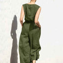 Olive green cotton-linen jumpsuit with button-back top, elastic waist, and pockets, back view.