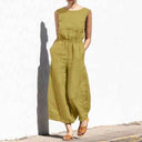 Olive green sleeveless jumpsuit with relaxed crew neck, front view on white background.