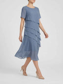 Blue tiered mini dress with short sleeves, angled view on a white background.