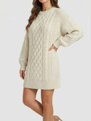 Cream cable knit mini dress with long sleeves, angled view on a white background.