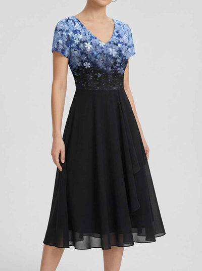 Black maxi dress with blue floral V-neck bodice, front view.