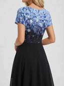 Blue floral bodice with black skirt, back view on white background.