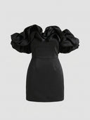 Black off-shoulder mini dress with large ruffled sleeves, front view on a white background.