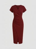 Red V-neck midi dress with short sleeves, ruched waist, and tulip hem, front view on a white background.