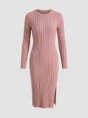 Pink ribbed knit midi dress with cable knit sleeves and side slit, front view.