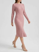 Pink ribbed knit midi dress with cable knit sleeves, angled view on white background.