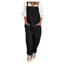 Black loose-fit jumpsuit with tie straps and large pockets, worn over a white shirt, front view.