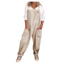 Beige jumpsuit with tie straps, large pockets, and rolled cuffs, front view.