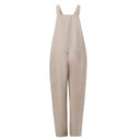 Beige jumpsuit with wide straps and loose fit, front view on white background.