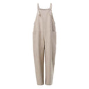 Tan jumpsuit with tie straps and side pockets, front view on white background.