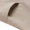 Close-up of the Moira beige jumpsuit side pocket with visible stitching.