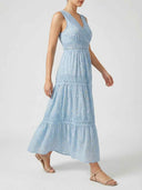 Light blue maxi dress with lace trim and polka dots, side view on white background.