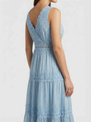 Light blue long sleeve mini dress with gold polka dots and lace trim, angled back view.