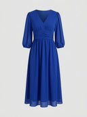 Blue V-neck mini dress with ruched waist and sheer long sleeves, front view on a light background.