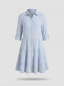 Blue and white striped mini dress with tiered skirt, button-down front, and rolled sleeves, front view.