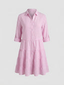 Pink and white striped tiered mini dress with rolled sleeves, front view on a white background.