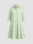 Light green and white striped tiered mini dress, front view.