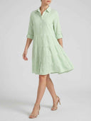 Light green and white striped tiered mini dress, angled front view.