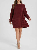 Reddish-brown fuzzy mini dress with long sleeves and two front pockets, front view.
