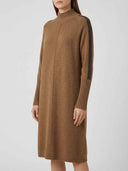 Brown knit mini dress with ribbed turtleneck and cuffs, dark stripe on sleeves, angled view.