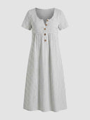 White and gray striped mini dress with short sleeves and wooden buttons, front view.