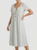 White and gray striped mini dress with short sleeves and button front, angled view.