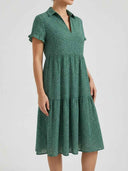Green floral dress with collar, V-neck, short ruffled sleeves, and tiered skirt, front view.