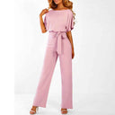 Pink one-piece jumpsuit with boat neck, short sleeves, and waist tie, front view on white background.