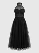 Black halter neck maxi dress with a sheer tulle overlay, front view.