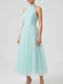 Aqua halter neck maxi dress with pleated bodice and full tulle skirt, front view.