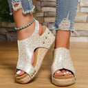Panther print cork platform wedge sandals with stud detail and open toe, front angled view on wooden floor.