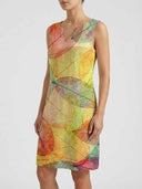 Sleeveless mini dress with colorful leaf print, V-neck, shown from the front on a white background.