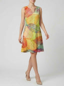 Sleeveless mini dress with colorful leaf print, V-neck, shown from the front.