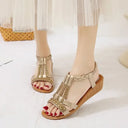 Khaki embellished flatform sandals with gold rhinestone straps and braided ankle strap trim, open-toe style, angled front view.