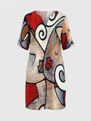 Shauna long sleeve mini dress with abstract floral pattern in red, white, black, and tan, front view on white background.