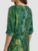 Green floral mini dress with gold accents and rolled sleeves, back view on white background.