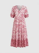 White and red floral V-neck maxi dress with ruffled sleeves and tiered skirt, front view.