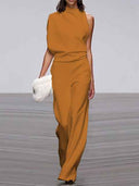 Orange sleeveless crew-neck jumpsuit with wide legs, front view on a gray background.