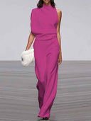 Magenta sleeveless jumpsuit with wide legs, front view on a gray background.