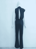 Black sleeveless jumpsuit with open back, shown from the back on a white background.