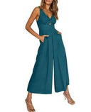Teal wide-leg overall with twisted bust, cut-out, and pockets, front view.
