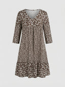 Brown mini dress with white floral print, V-neck, 3/4 sleeves, and tiered skirt, front view.