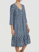 Blue floral mini dress with V-neck and tiered skirt, angled front view.