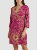 Fuchsia mini dress with gold paisley print, V-neck, 3/4 sleeves, front view.