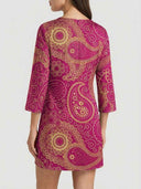 Magenta mini dress with gold paisley print, back view.