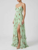 Mint green floral maxi dress with corset bodice and thigh-high slit, angled front view.
