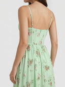 Light green floral maxi dress with corset bodice and zipper, back view.