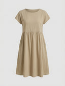 Tan mini dress with short sleeves, round neck, and gathered waist, front view.